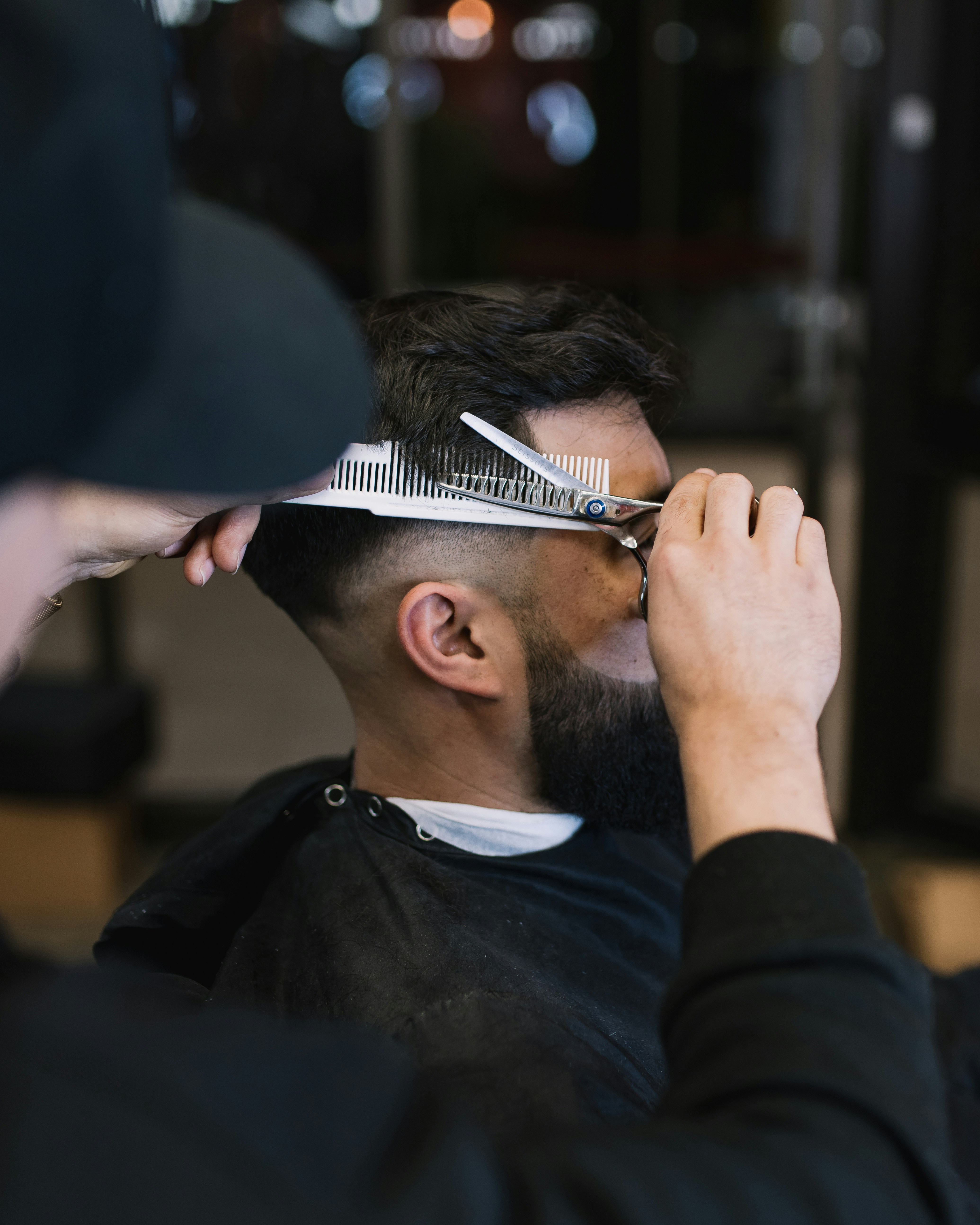 Barber cutting hair